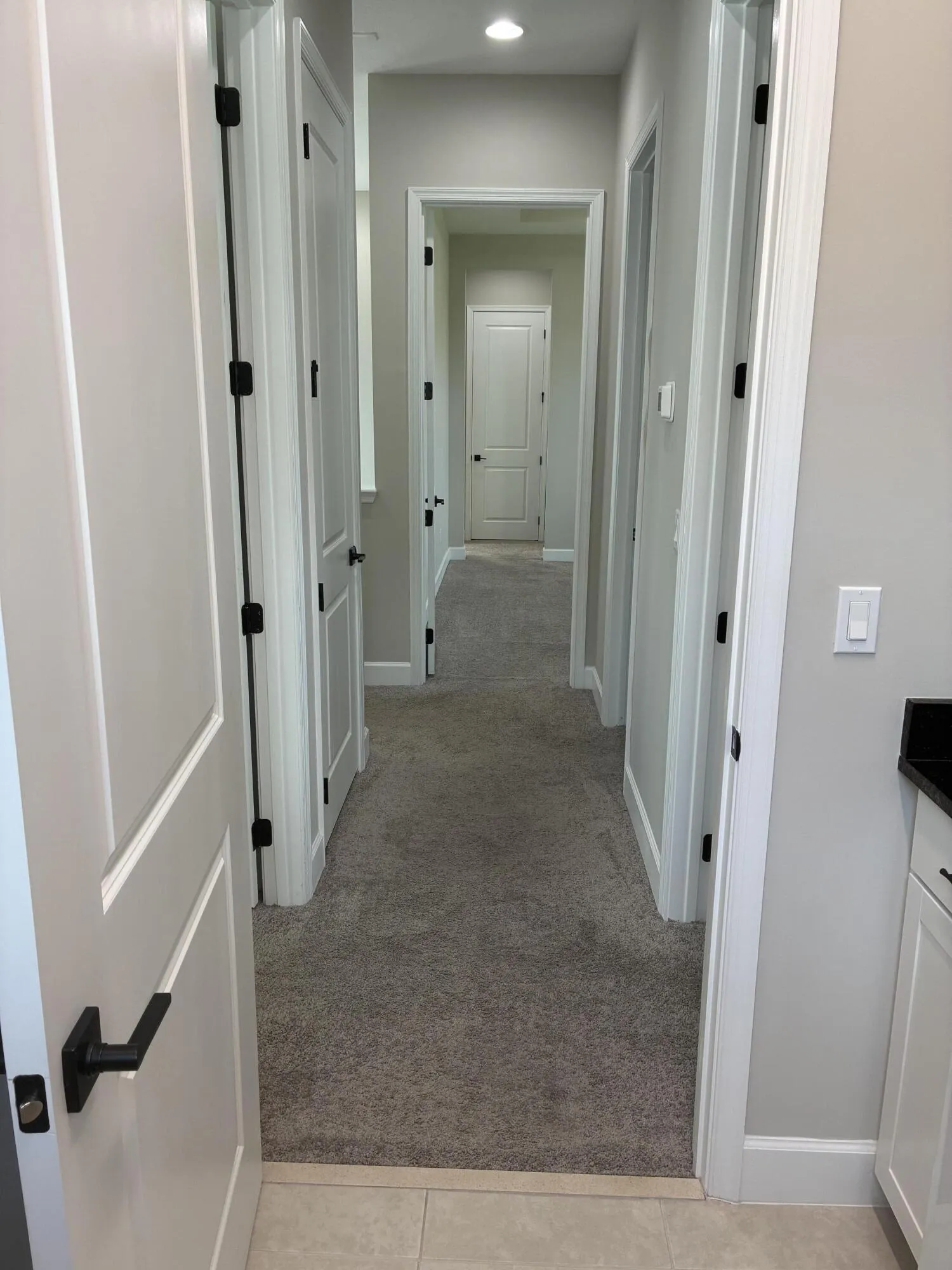Hallway to upstairs rooms from laundry r