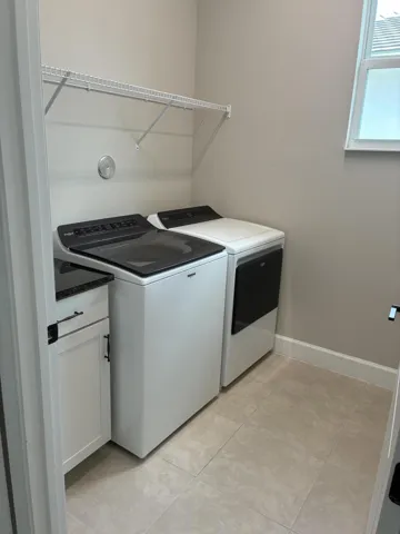 Upstairs laundry room with Whirlpool app