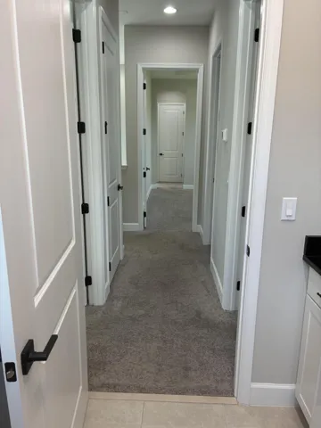 Hallway to upstairs rooms from laundry r