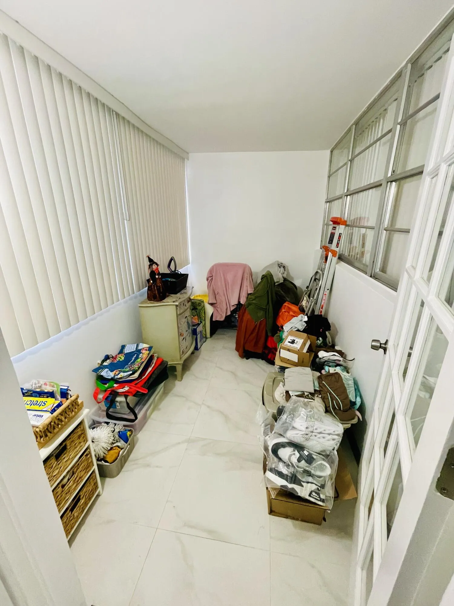 Enclosed balcony can be extra bedroom.