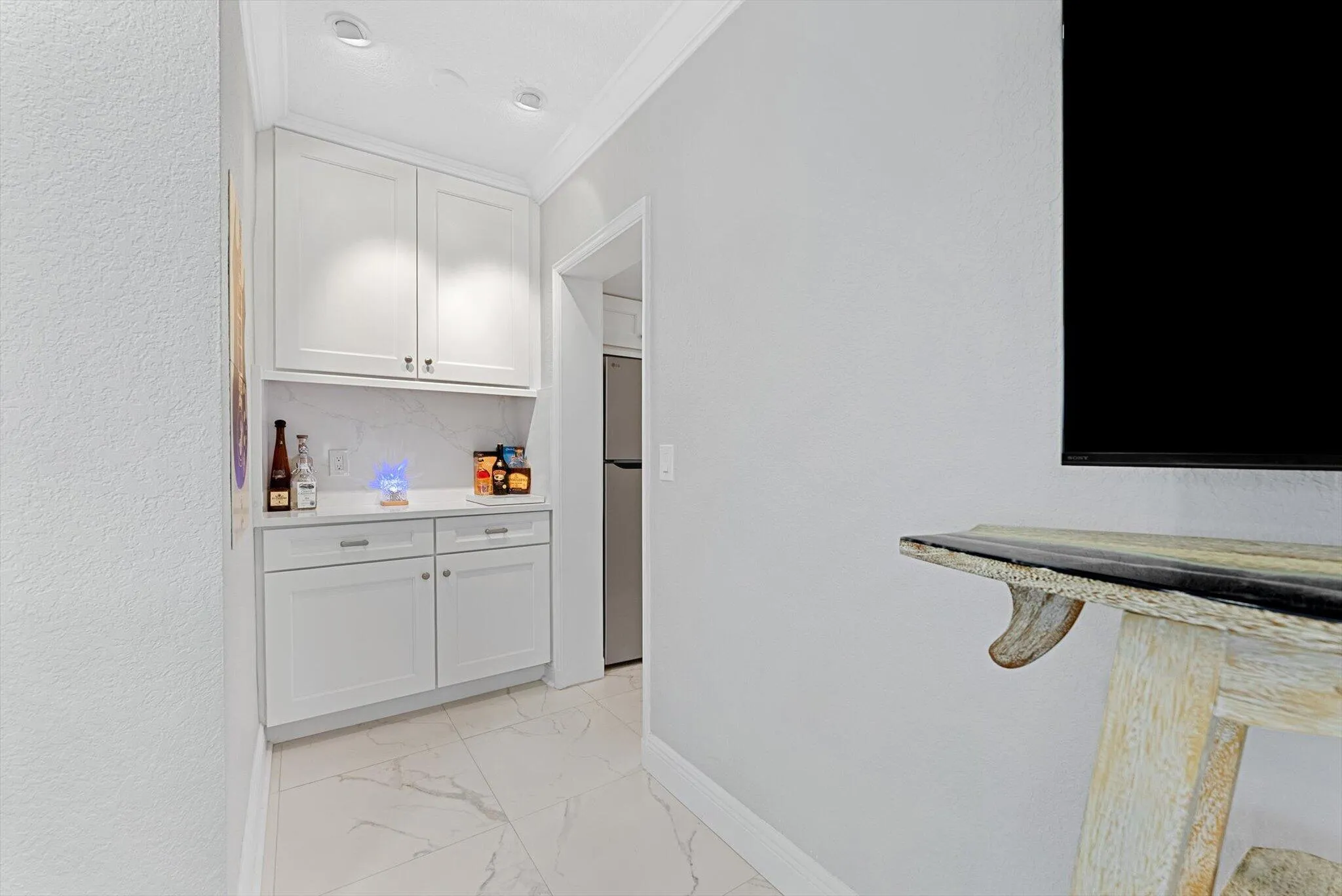 Built-in bar and storage unit.