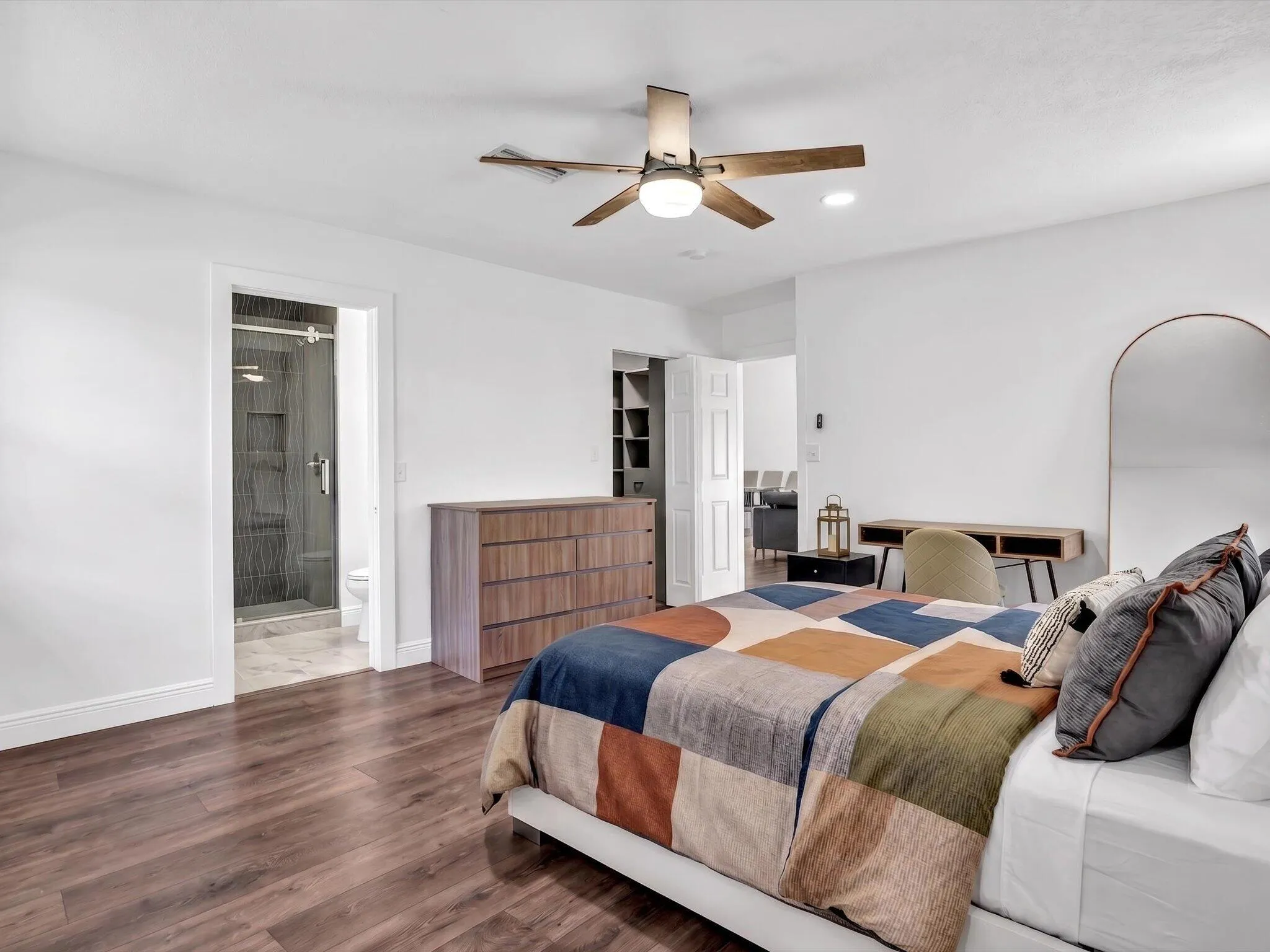 Wood-finish flooring, ceiling fan, and recessed lighting