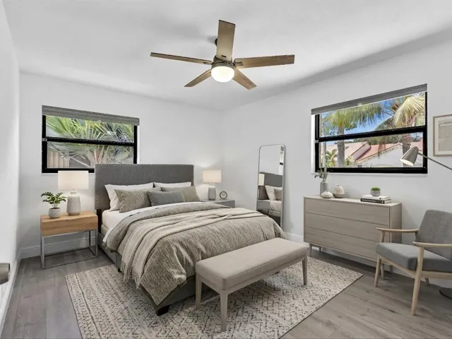 Wood-finish flooring, recessed lighting, and a ceiling fan