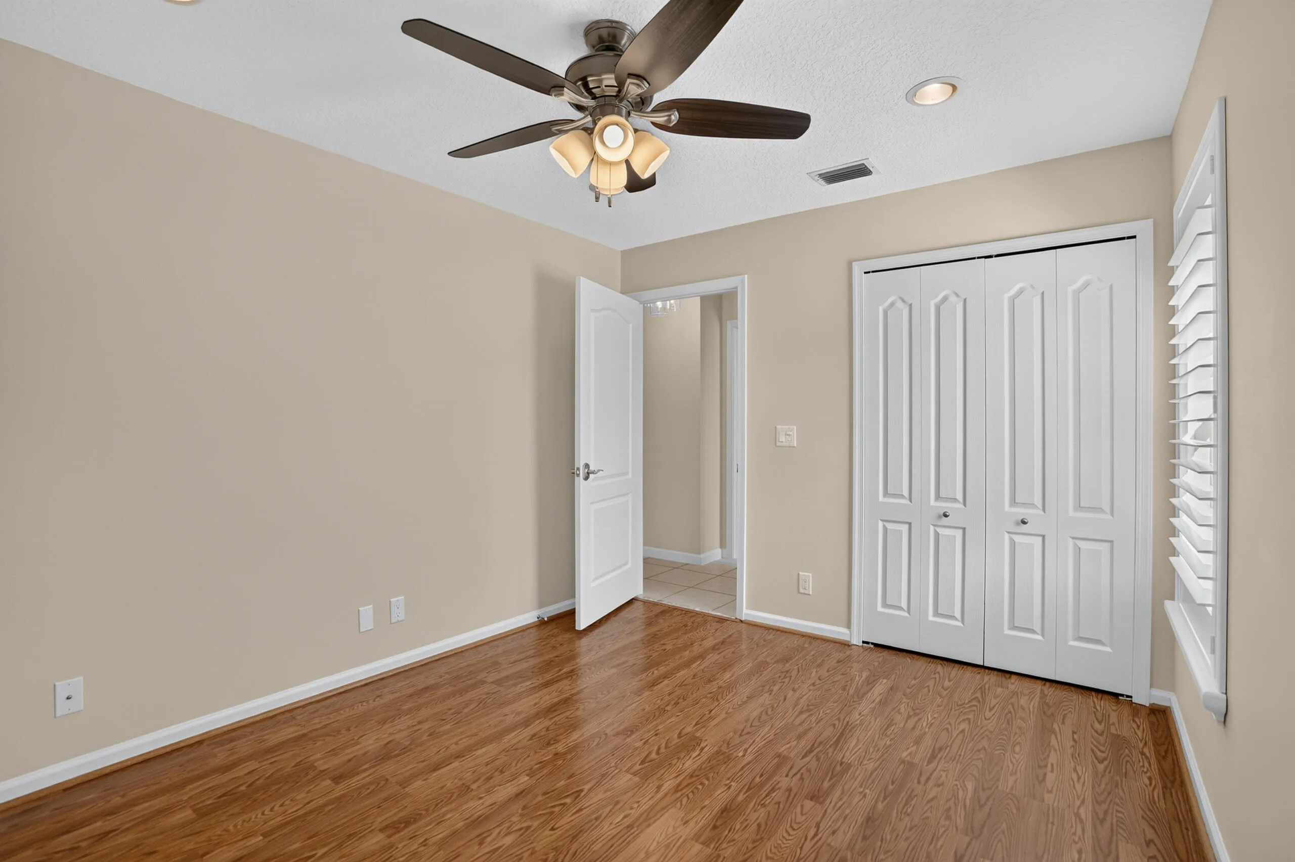 New light fixtures and fans. Plantation shutters throughout