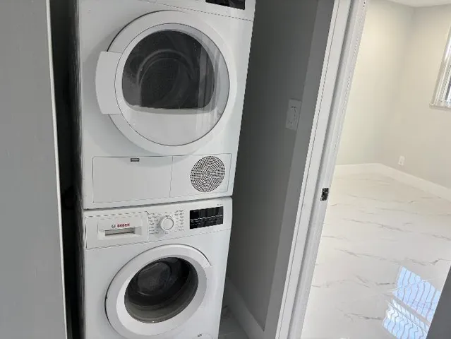 Stacked washer and dryer in unit