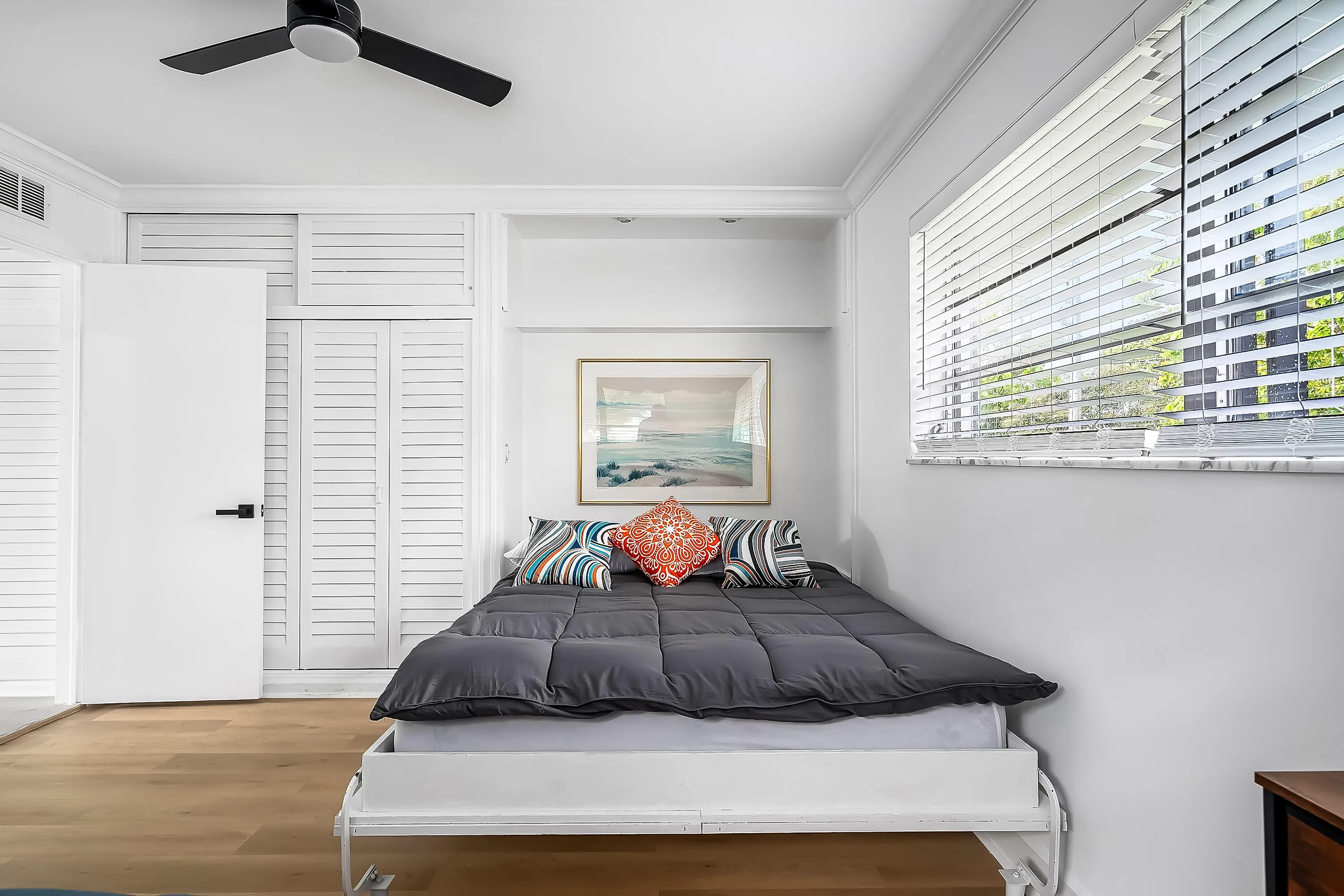 Bedroom featuring wood-finish flooring and a ceiling fan