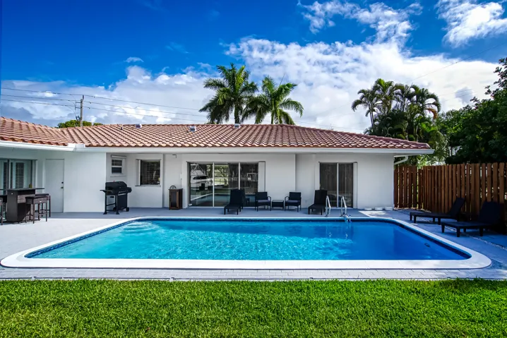 Rectangular swimming pool with a surrounding paved deck