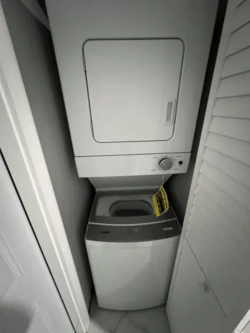White stackable washer and dryer unit