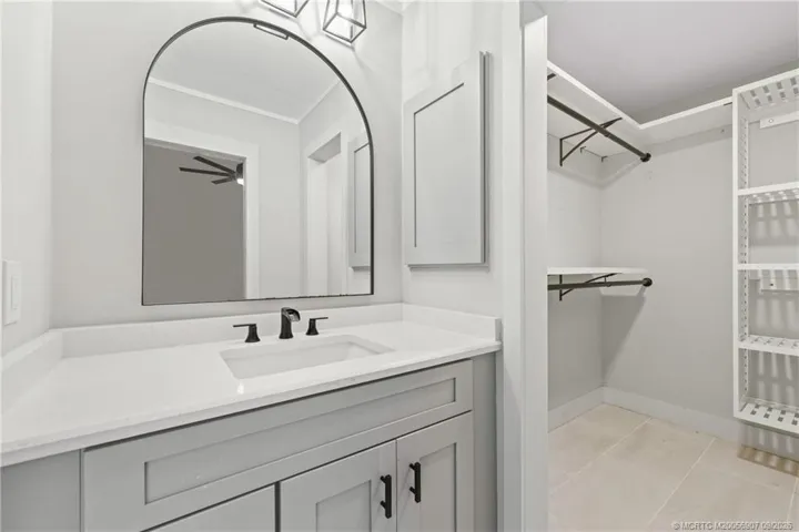 View of Vanity and Walk-In Closet
