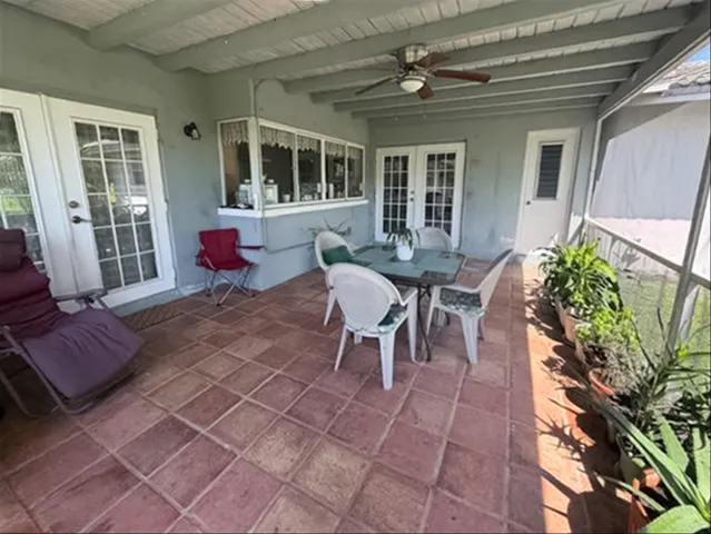 Covered screened patio with pass through from the Kitchen