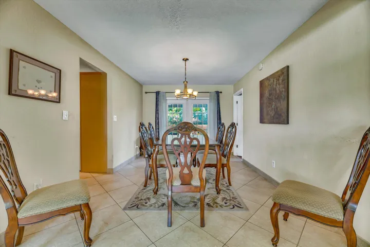 Dining Room with French Doors to the Covered screened Patio