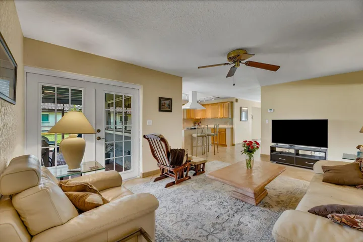 Family Room with Franch Doors to the covered screened Patio