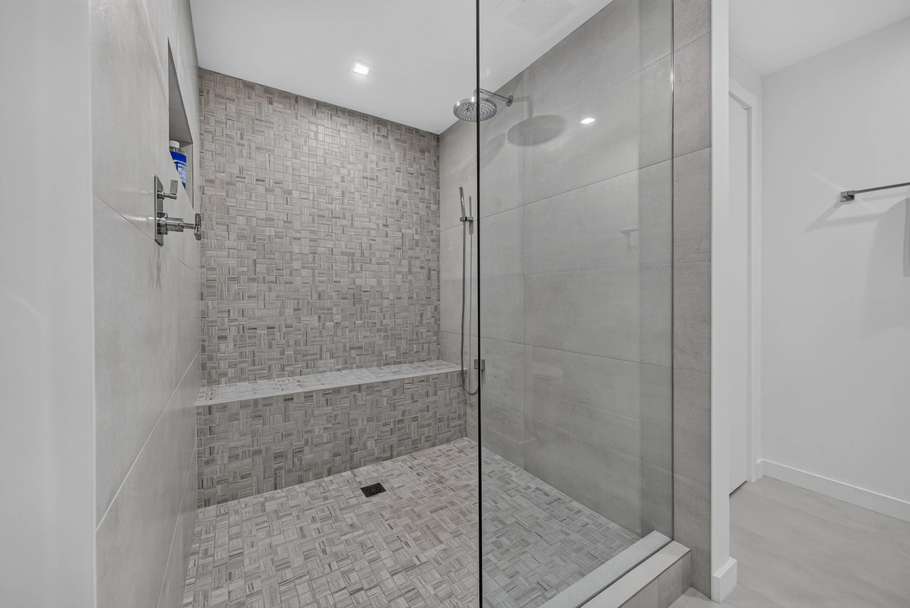 Large luxurious shower with seating