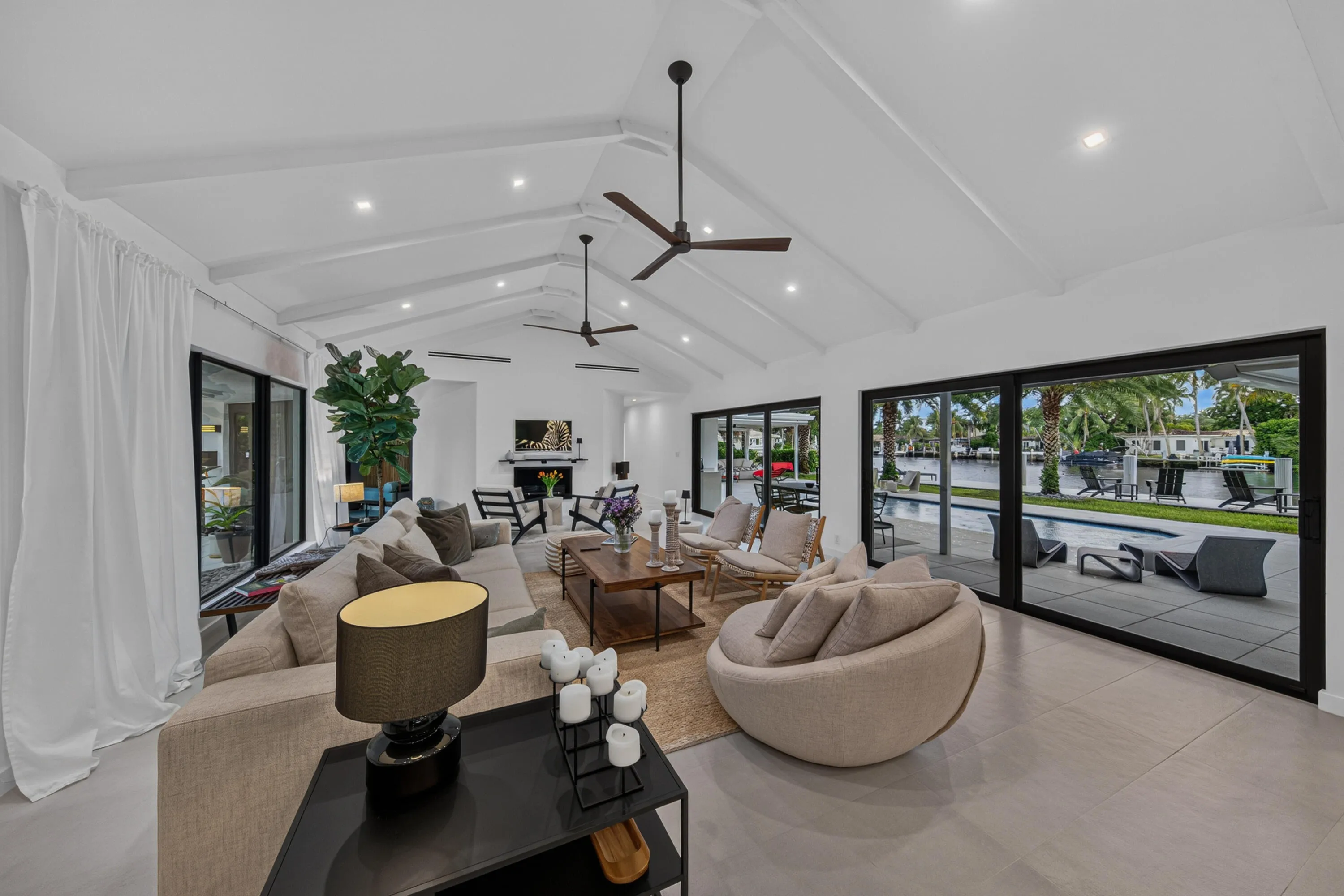 Living area opens to the pool and back patio for enjoyment and entertainment.
