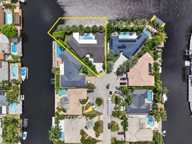 Aerial view of home on gorgeous point lot outlined in yellow