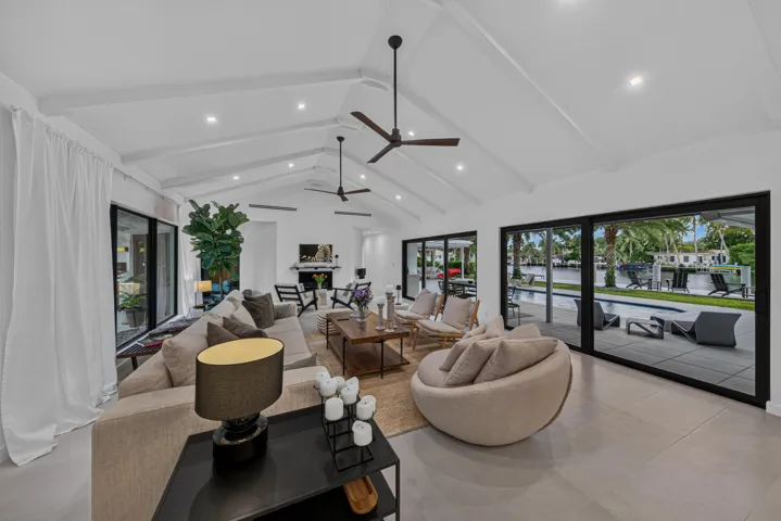 Living area opens to the pool and back patio for enjoyment and entertainment.
