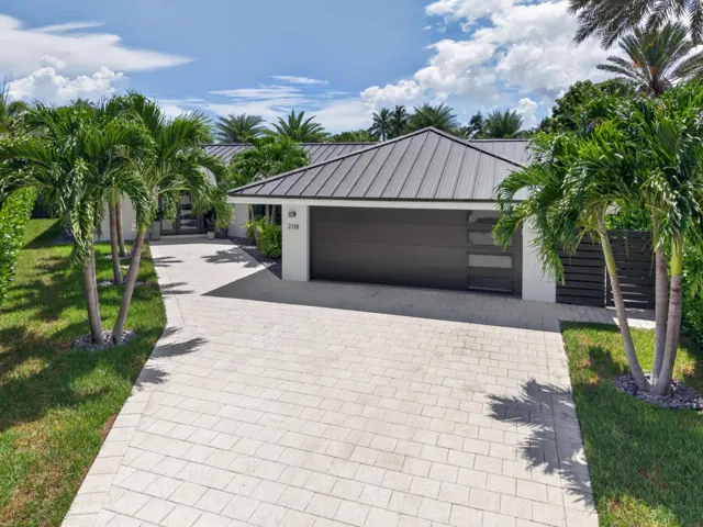Aerial view of two car garage and paver driveway. Plenty of parking.
