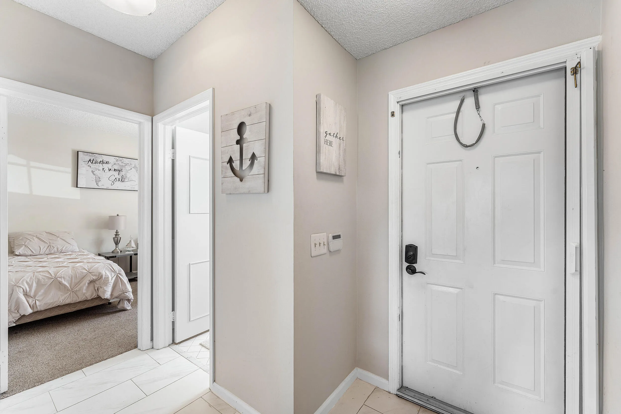 Front Door Foyer With Entries to Bedroom #2 & Bath #2 & Laundry​​‌​​​​‌​​‌‌​‌‌​​​‌‌​‌​‌​‌​​​‌​​ Room