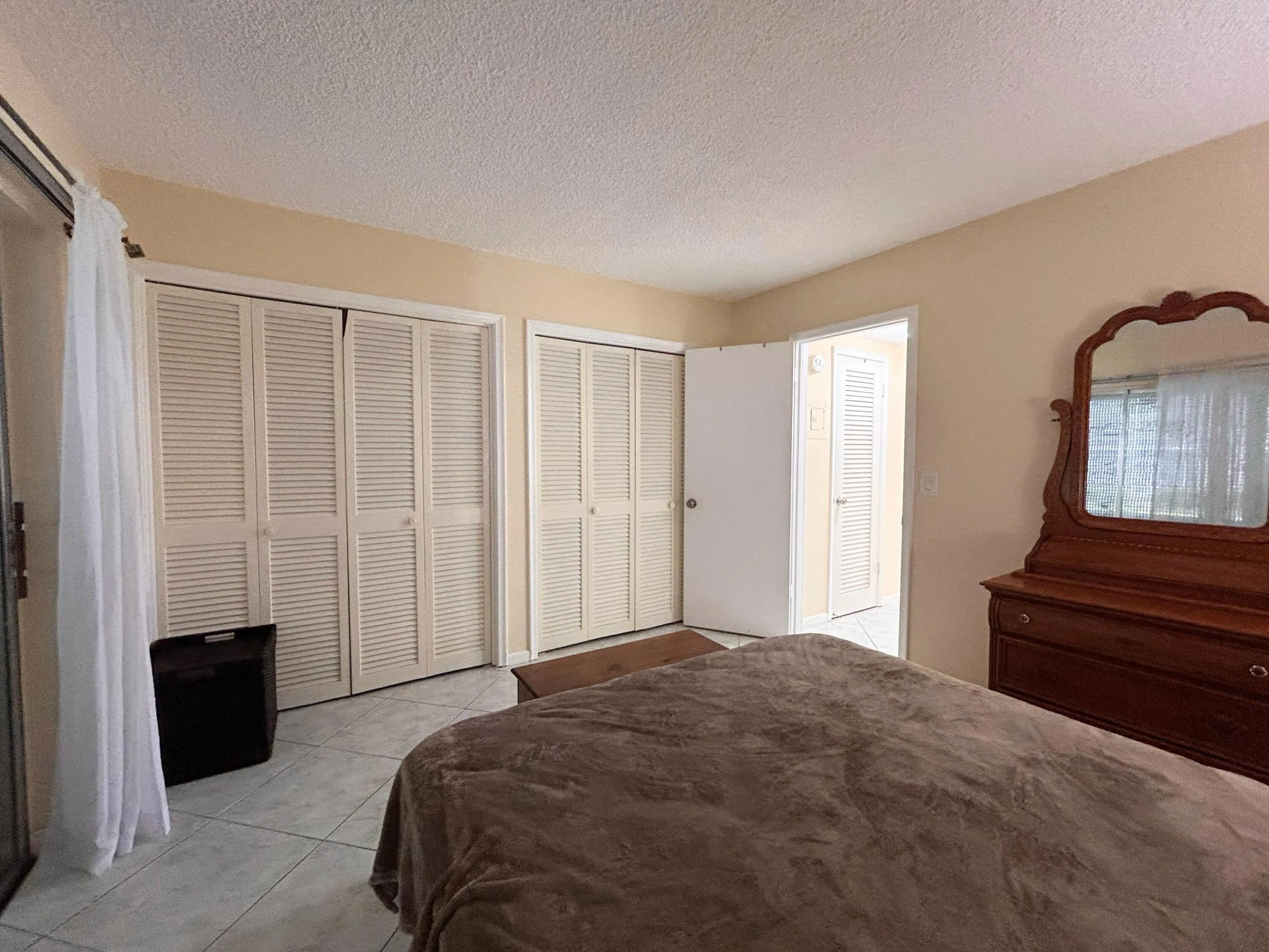 WALL LINED W/ CLOSETS