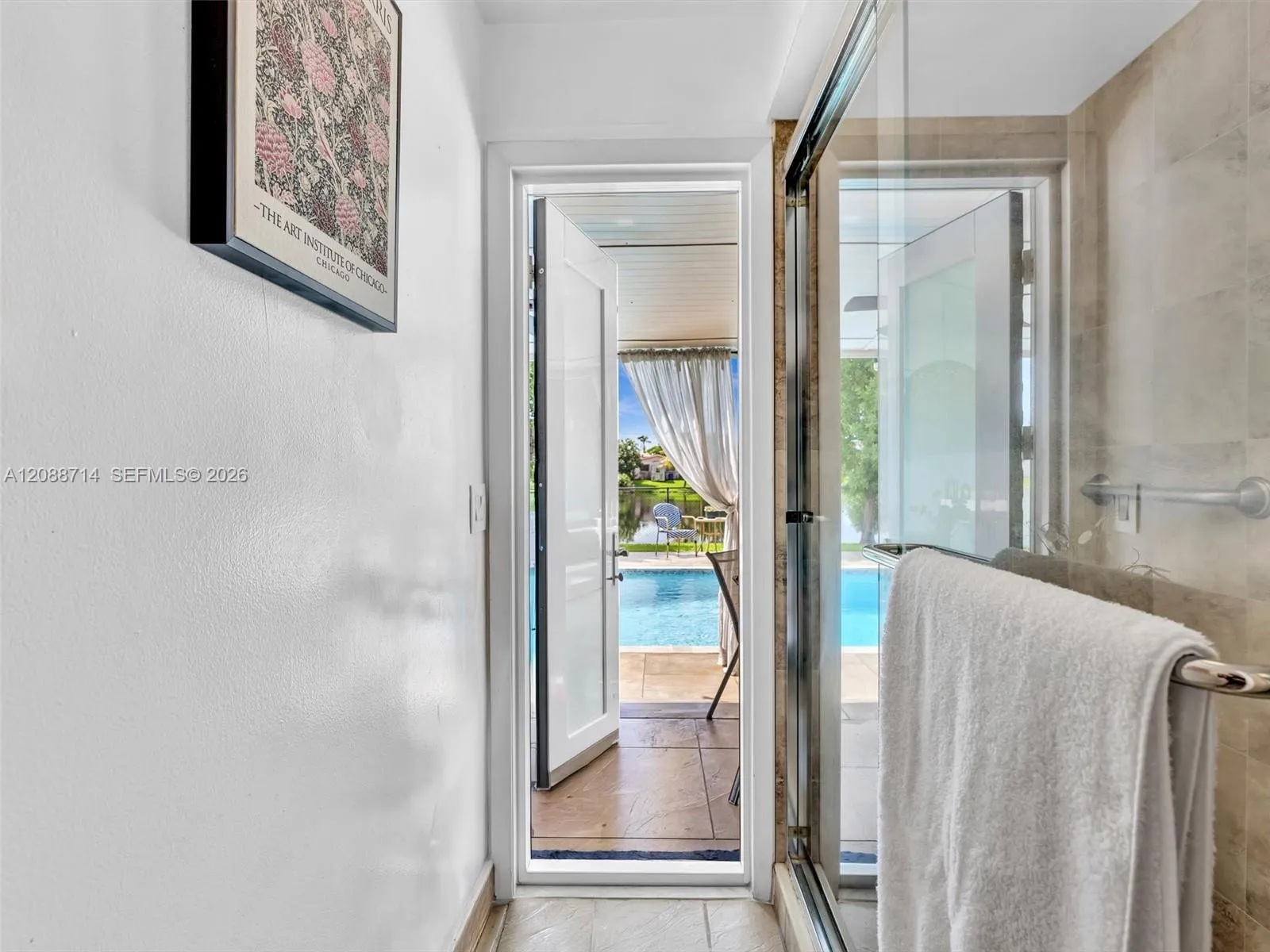 Guest bathroom with caban door to pool