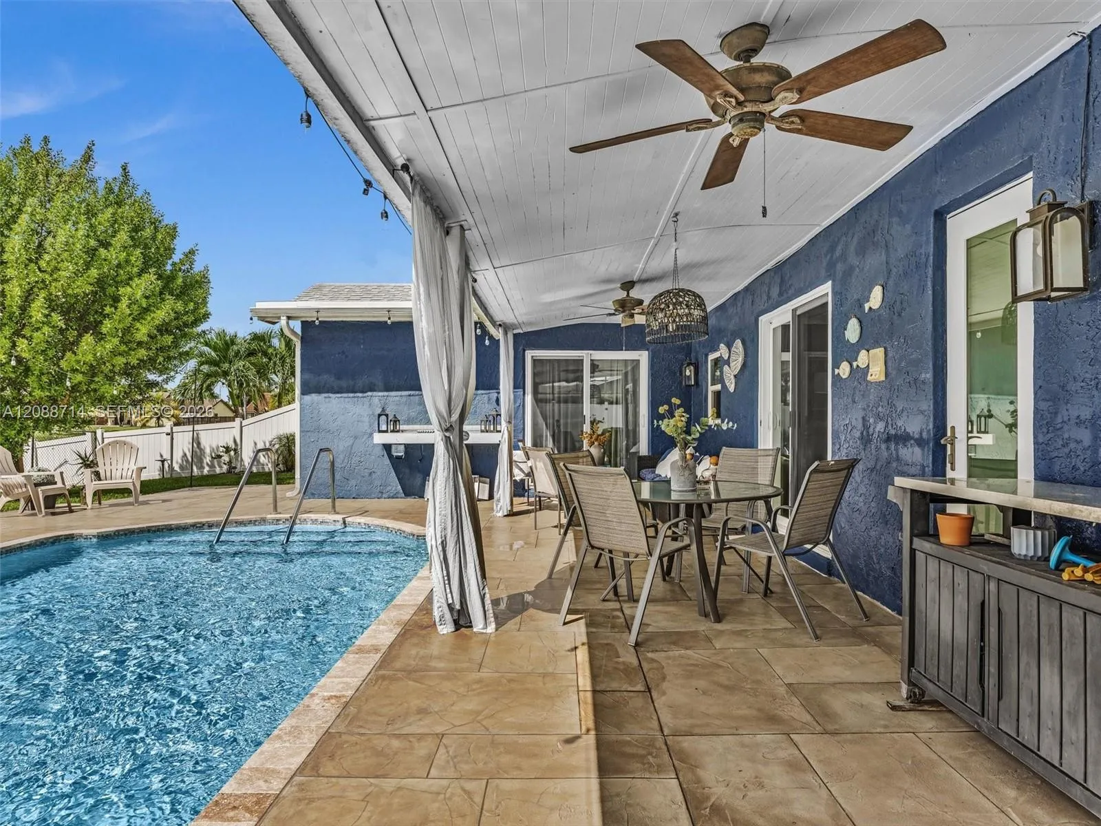 Extended covered patio with plenty of room to entertain