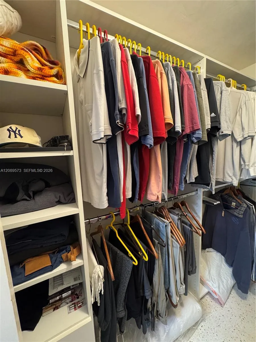 Custom shelving in primary BR walk-in closet.