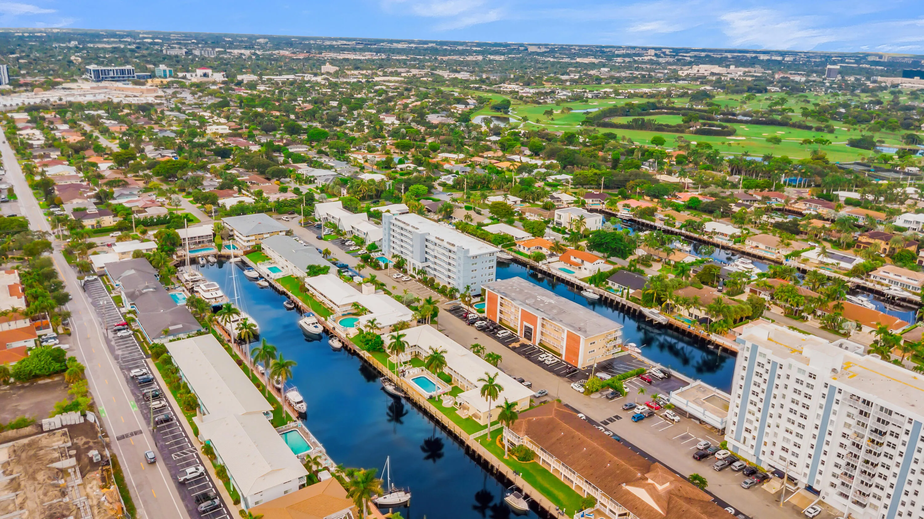 Waterfront properties with direct canal access, surrounded by mature trees, and nearby open greenspace