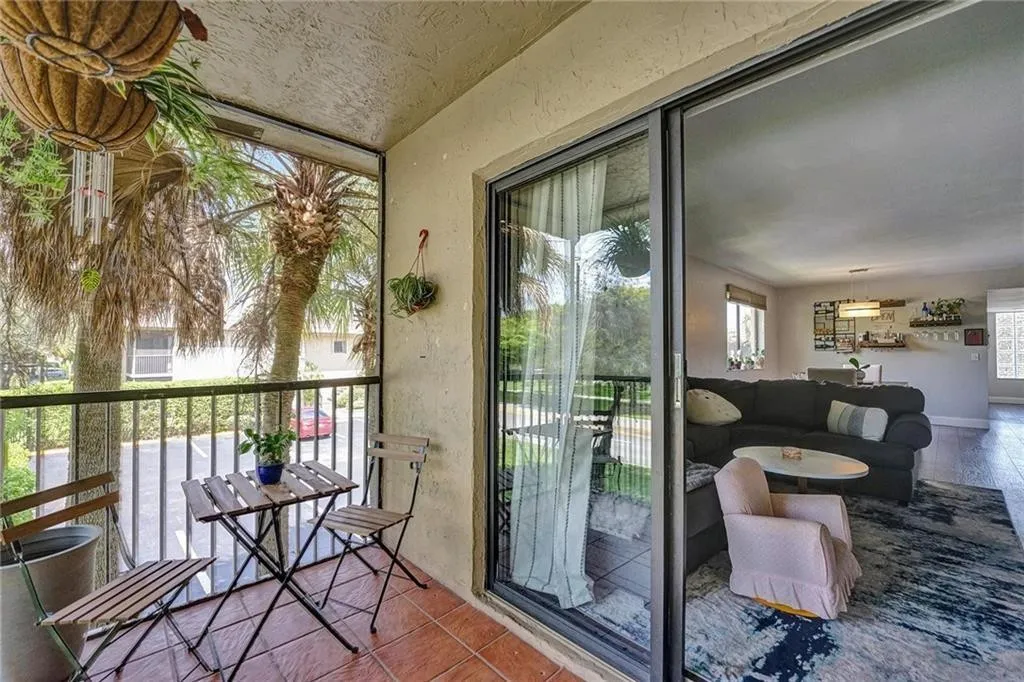 Fully tiled patio, screened for year round outdoor comfort.