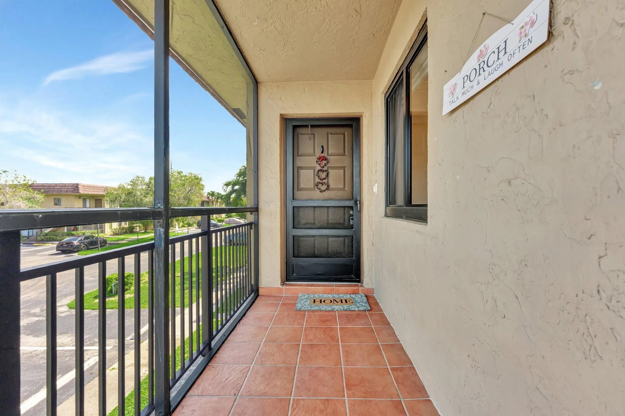 Long screen-in tiled entry way