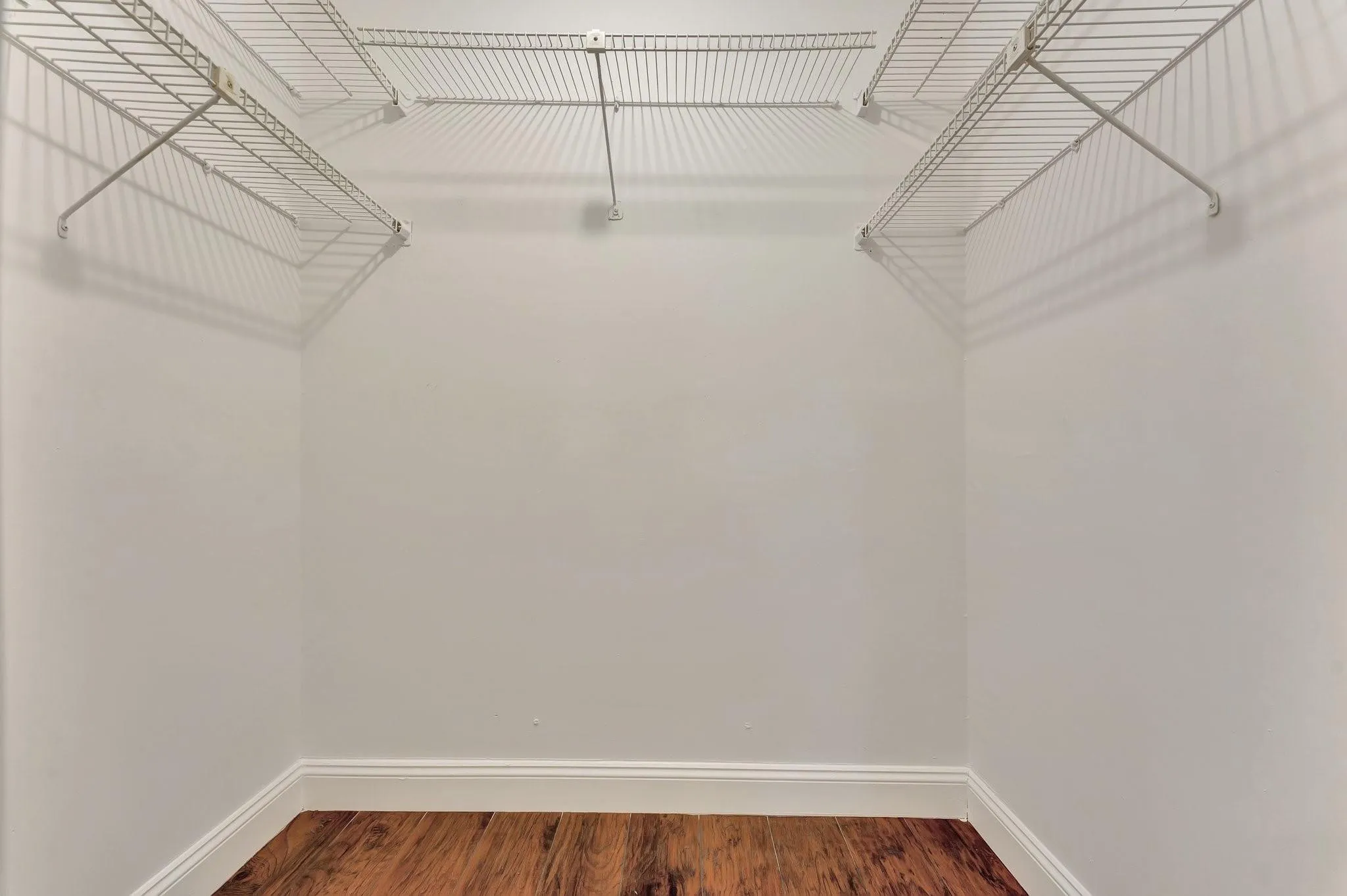 Walk-in closet in primary suite.