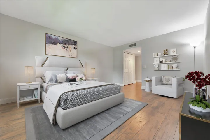 Luxury engineered wood plank flooring throughout, walk-in closet.