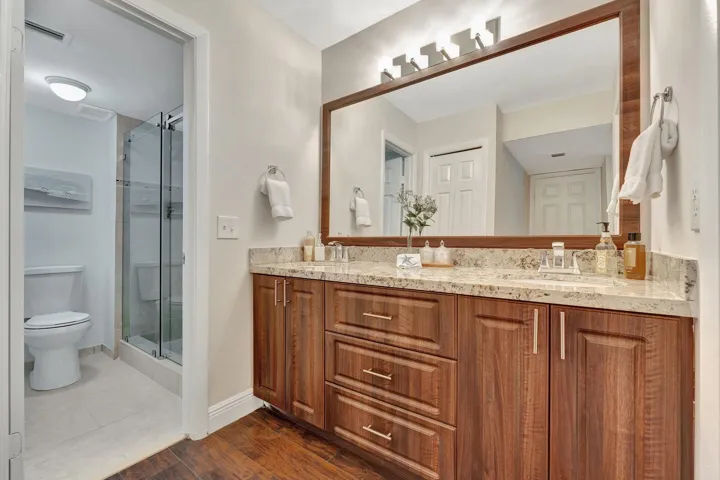 Granite /wood cabinetry, separate shower area, huge walk in closet and spacious 2nd closet.