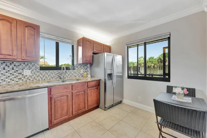 Eat-in kitchen overlooks the front patio.