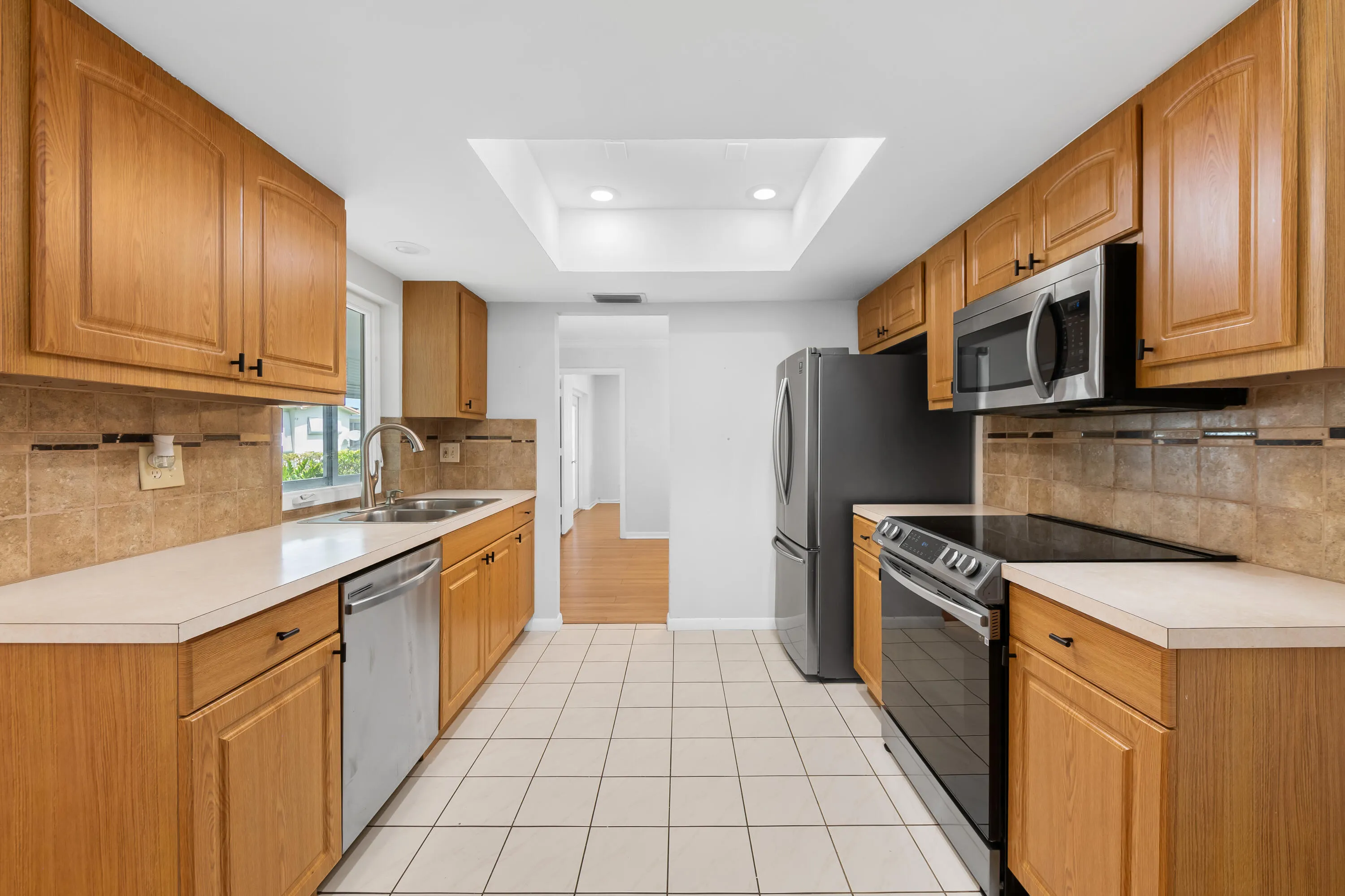 Kitchen with upgrades that include Stainless Steel appliances and new cabinet pulls.