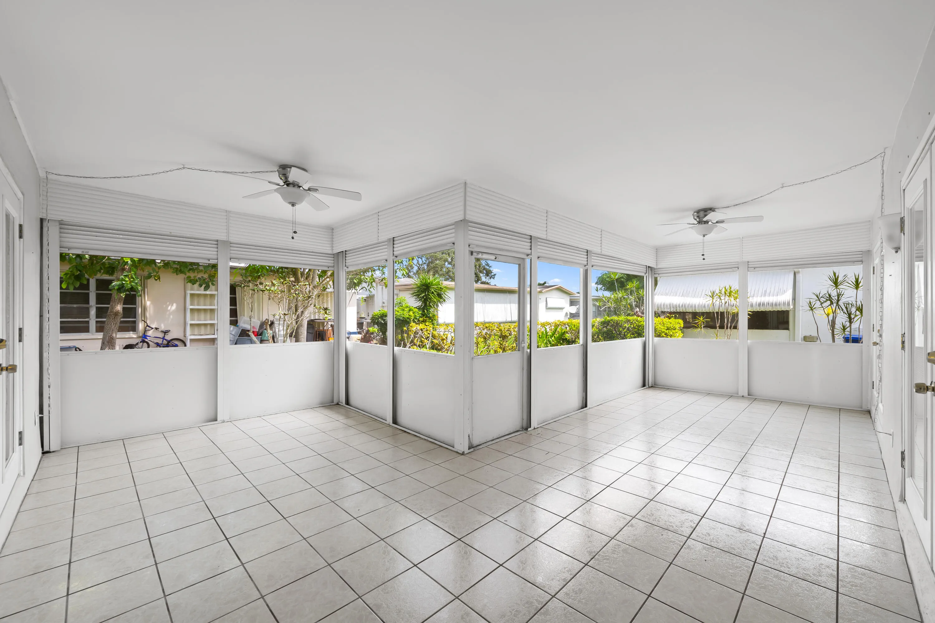Screened in Back Patio with rolling shutters and newer updated hardware.