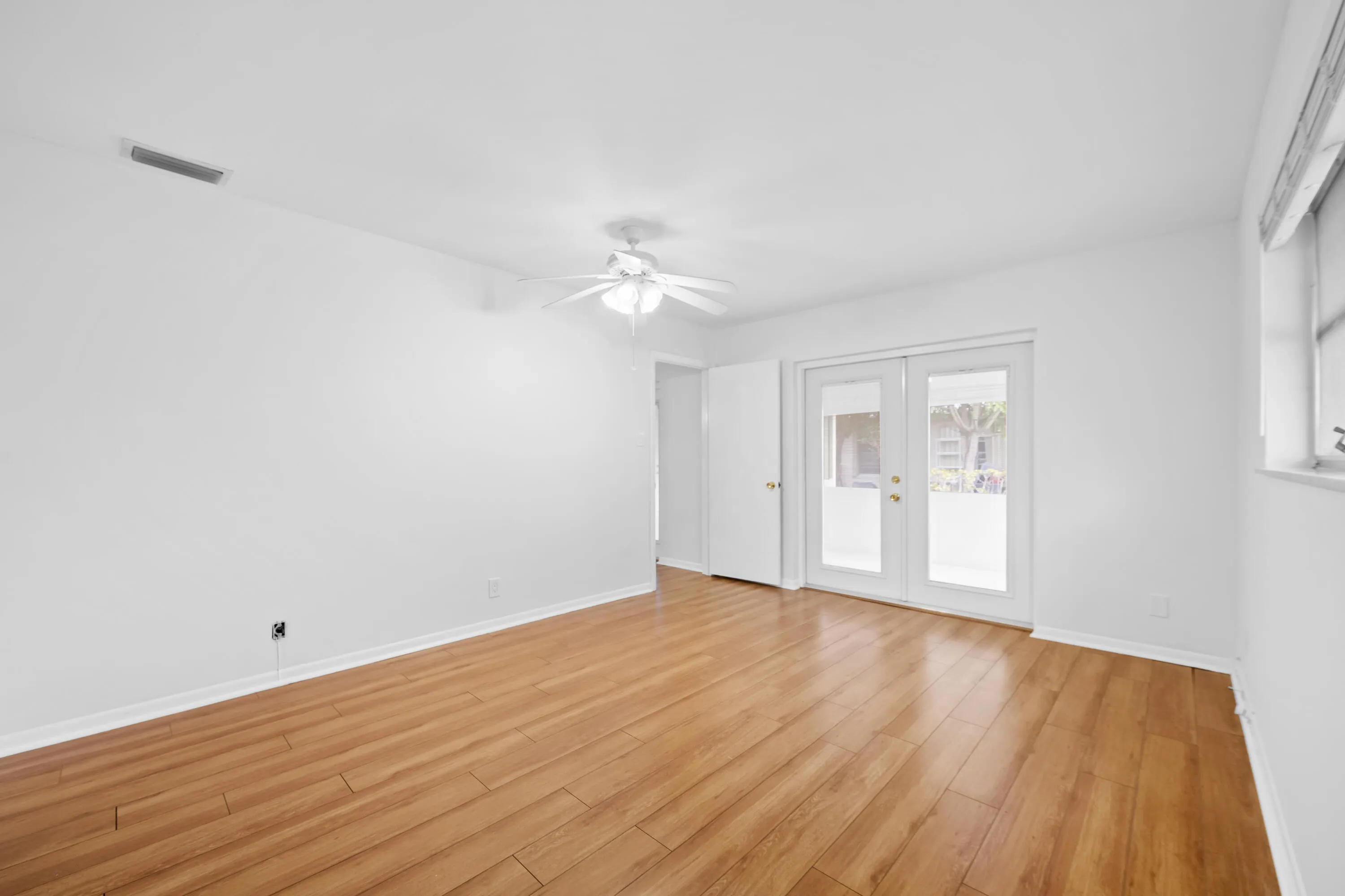 Primary Bedroom with French Doors to Screened Back Patio