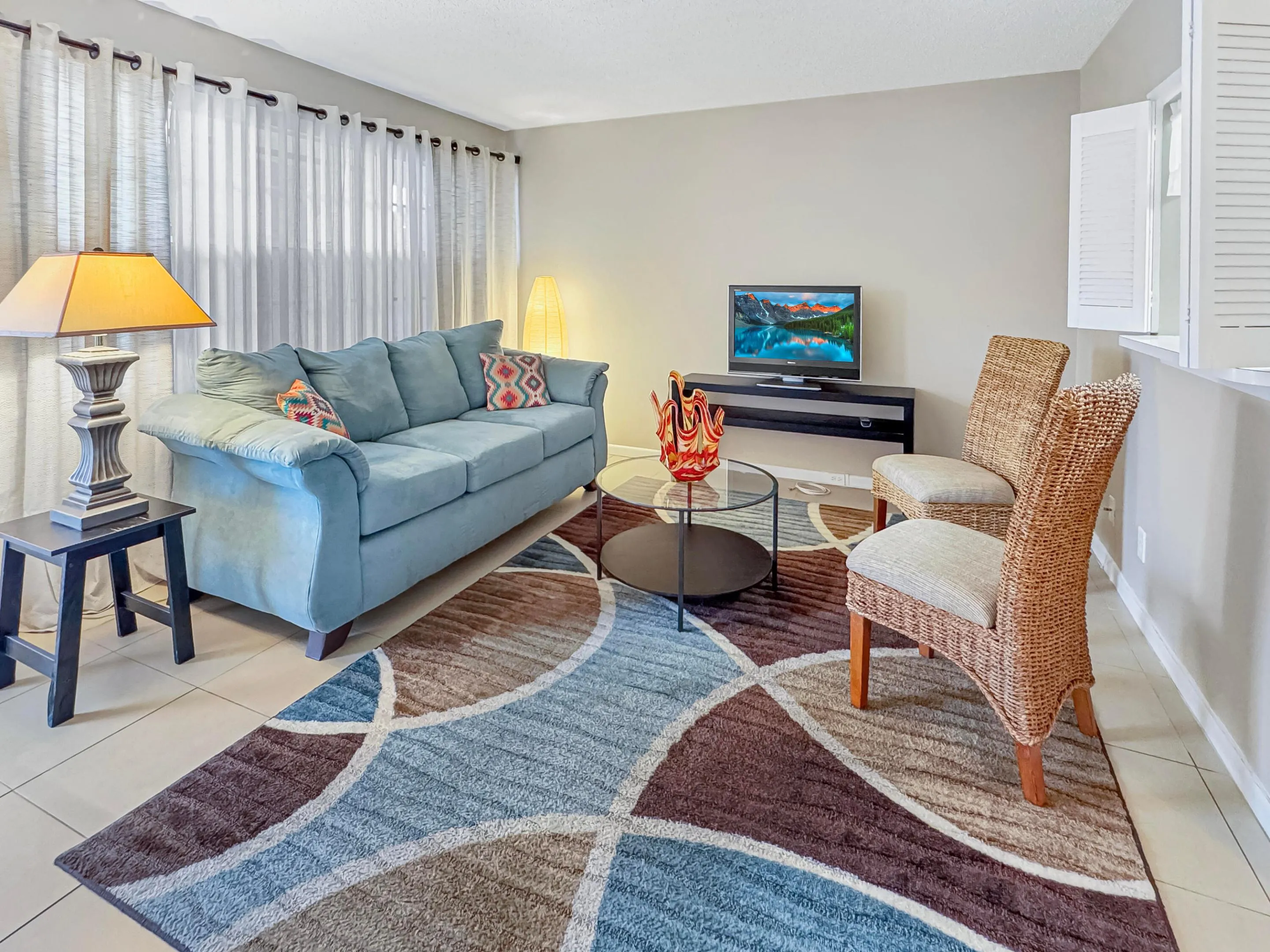 Tiled flooring extends throughout the space, complemented by neutral wall paint