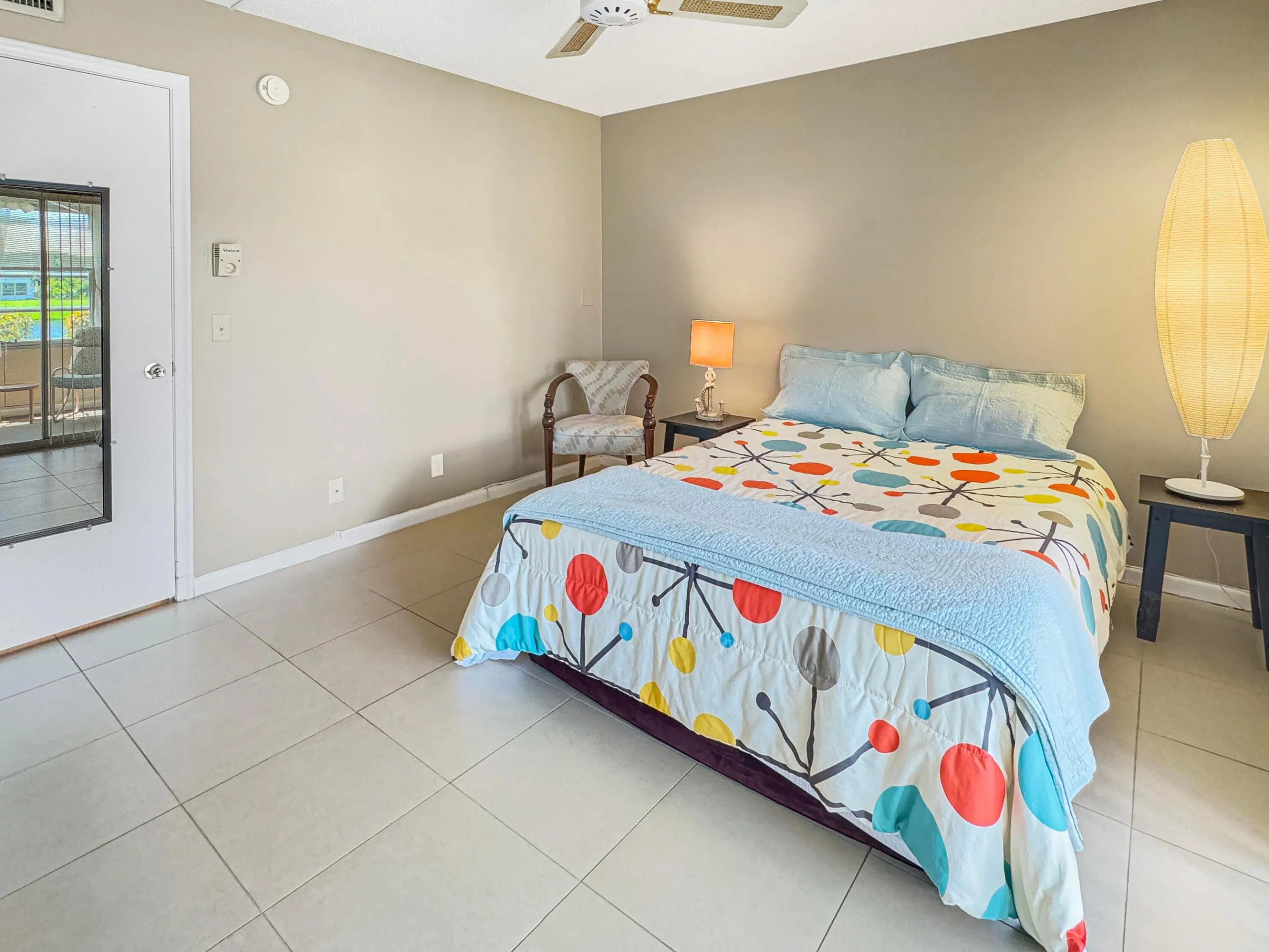Neutral-toned walls complement the light tile flooring