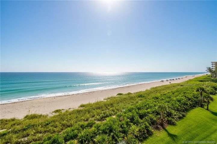 Panoramic ocean and coastline views from the unit.