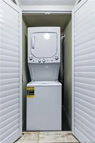 Convenient in-unit laundry with stacked washer and dryer.
