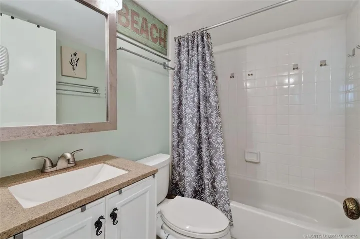 Additional view of the guest bathroom with tub/shower combination.