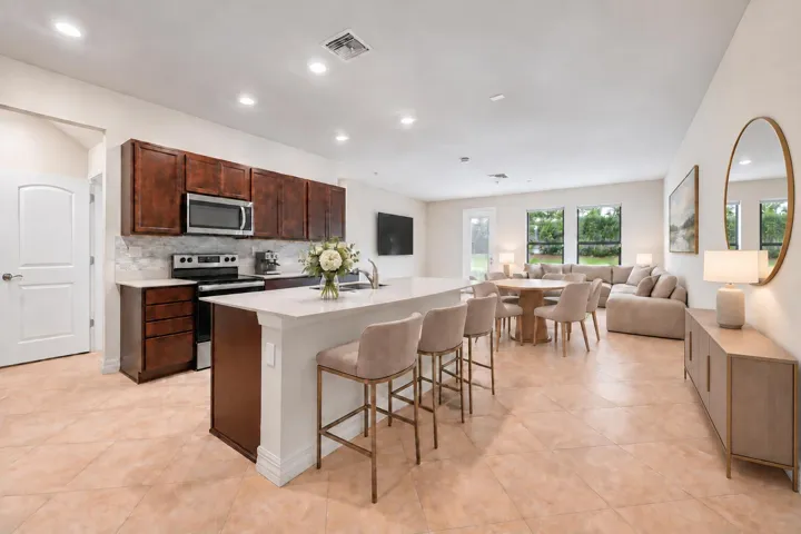 Living Room, Dining area and Kitchen virtually staged.