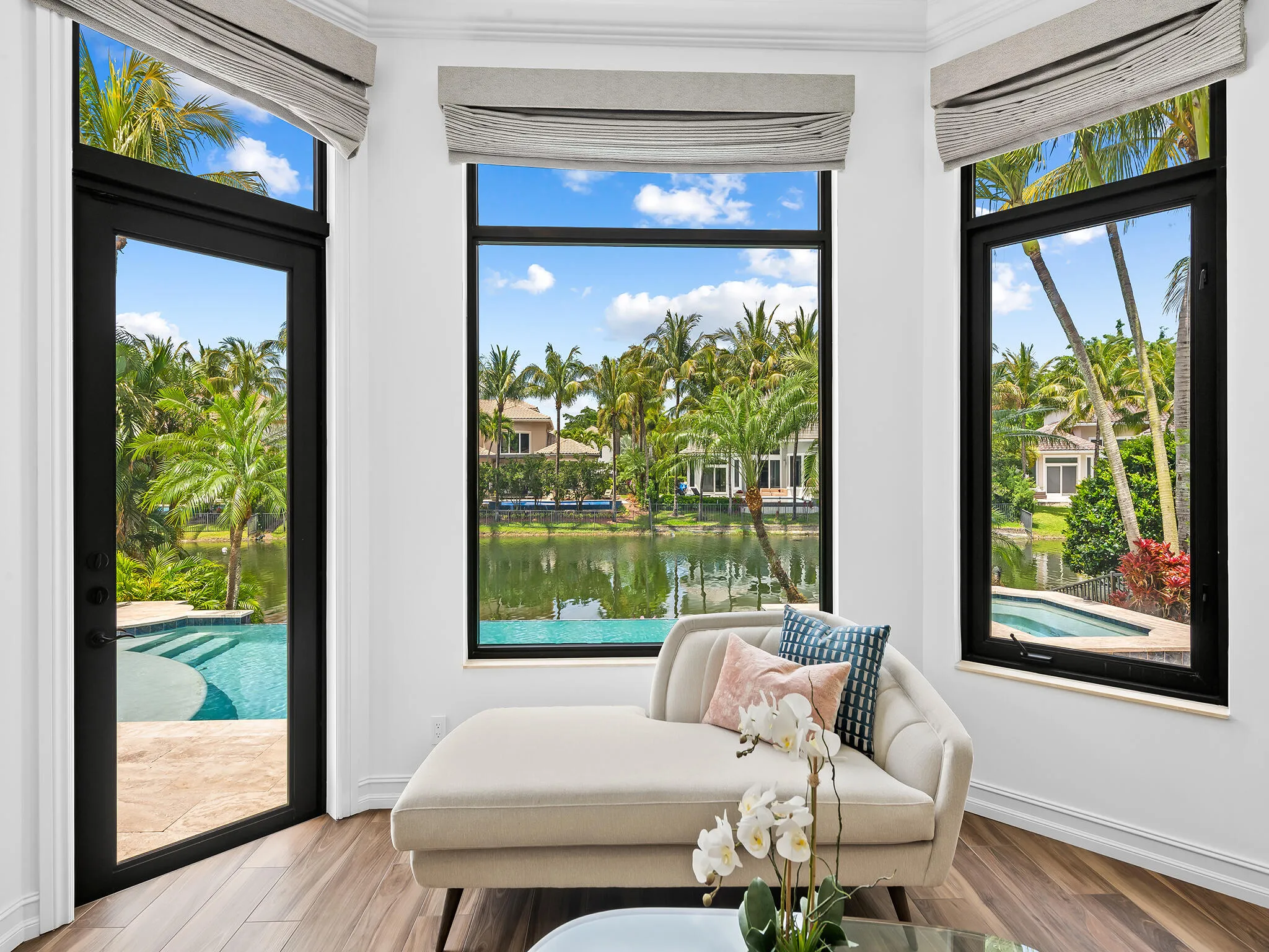 Primary Suite Sitting Area Overlooking Pool and Water View