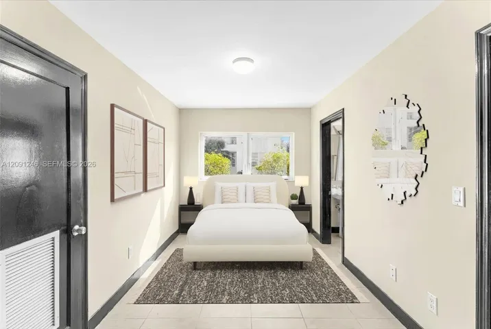 second bedroom with en suite bath and large laundry room
