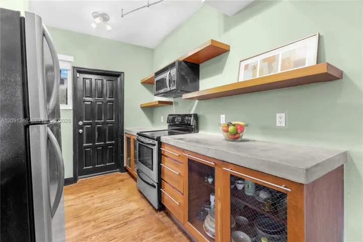 kitchen with door leading outside, perfect for air flow