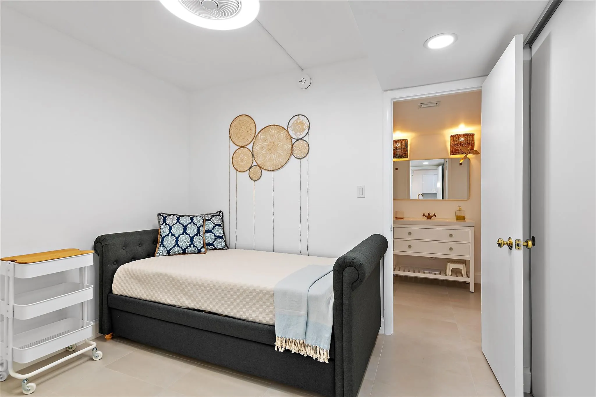 Second room with closet and passway to full bathroom.