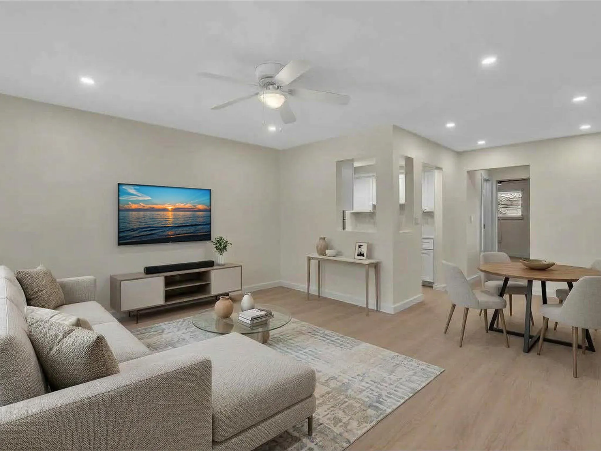 Virtually Staged Living Room and Dining Area open to the Galley Kitchen