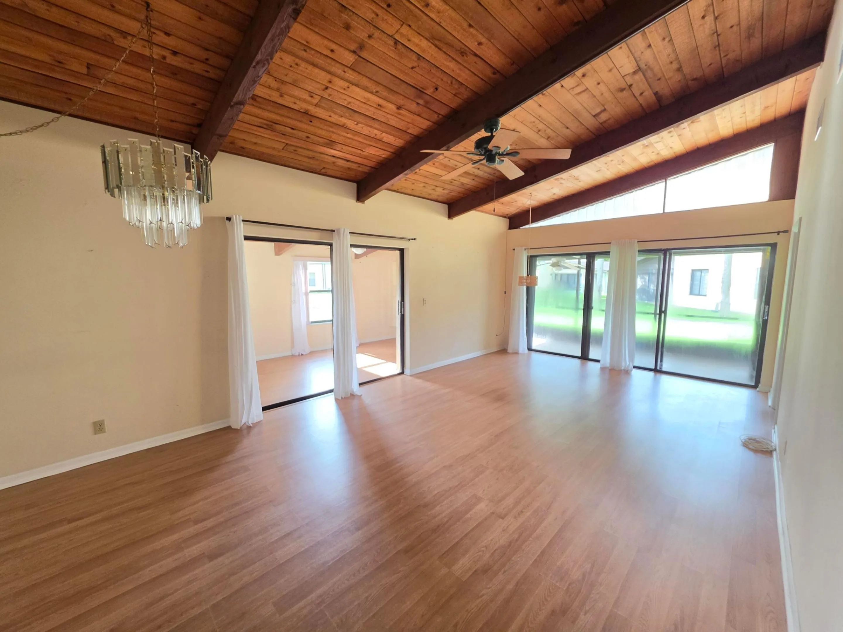 THIS AREA ENJOYS BEAUTIFUL SUNNY VIEWS OF THE OUTDOORS, ACCESS TO THE SCREENED PATIO AND PLENTY OF NATURAL LIGHT.