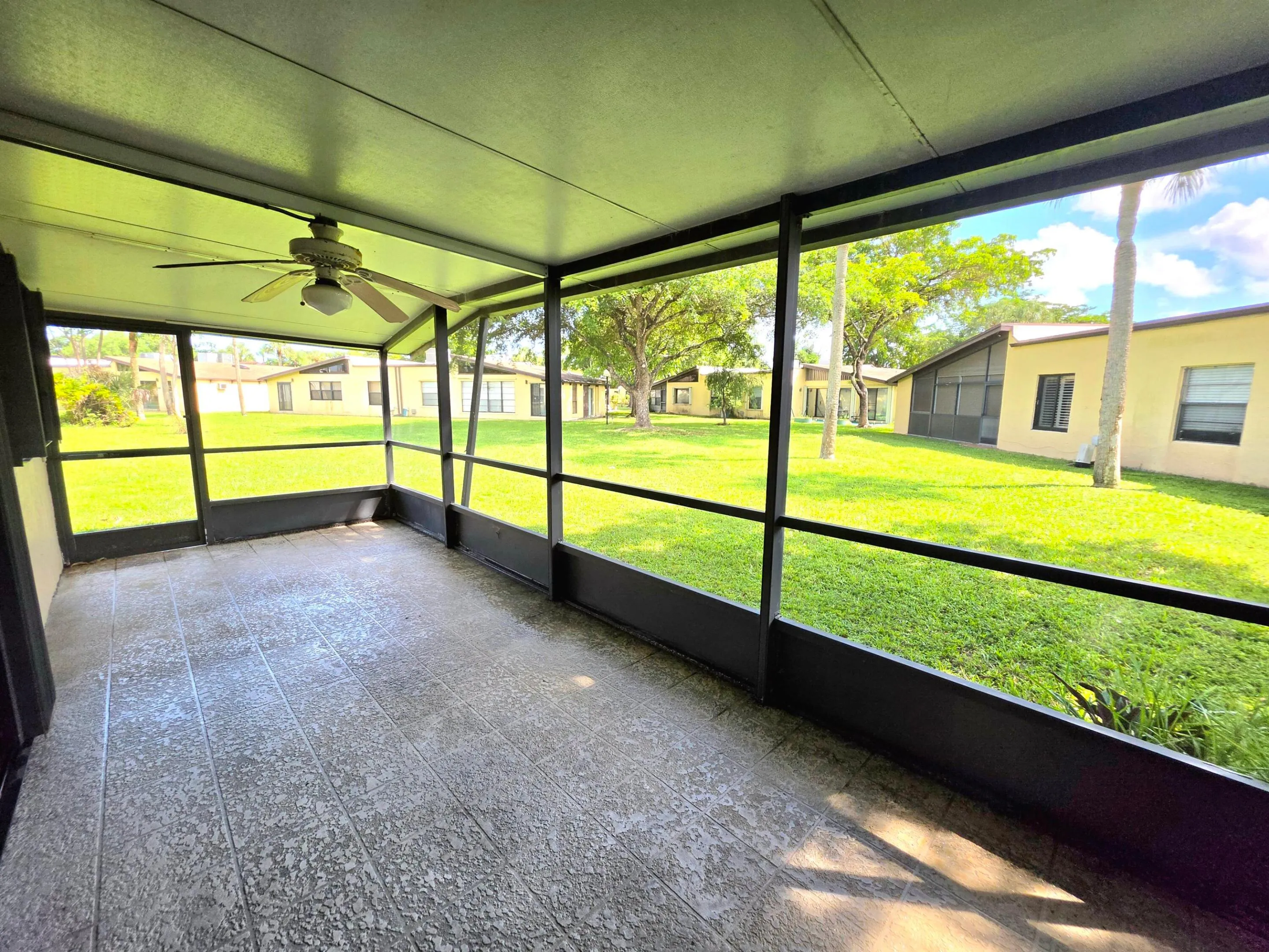 COVERED AND SCREENED, THE OVERSIZED BACK PATIO HAS PLENTY OF SPACE TO ENJOY SUNNY SOUTH FLORIDA WEATHER. COFFEE, BEVERAGES OR A GOOD BOOK..
