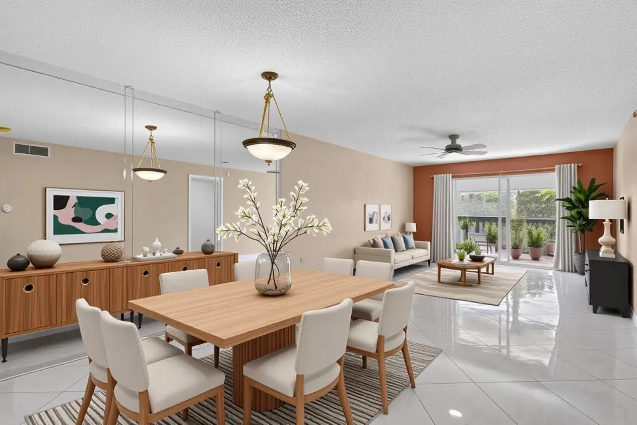 Glossy tile flooring extending throughout, mirrored accent wall, recessed lighting, ceiling fan, and sliding glass doors to the exterior